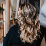 womens long balayage blonde highlight wavy hair color