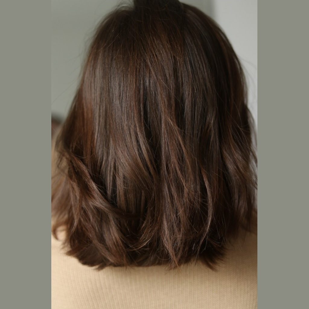 brunette tousled medium length hairstyle