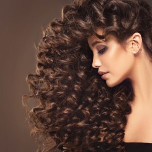 womens long tight curls hairstyle brunette