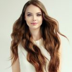 womens long wavy layered hairstyle brown hair