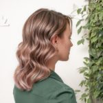 womens medium length wavy hairstyle blonde hair