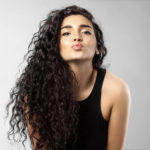 womens long black natural curly hairstyle