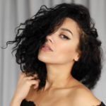 womens side swept curly bob cut messy hairstyle