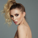 womens slick curly high ponytail hairstyle blonde hair