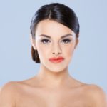 women slicked pulled back locks hairstyle