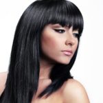 womens straight and sleek medium length hairstyle dark hair