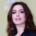 anne hathaway long dark wavy hair with curtain bangs