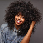 women's long curly afro hairstyle