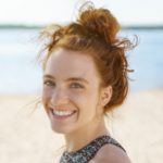 women's long curly messy high bun hairstyle