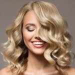 women's blond shoulder length wavy hairstyle