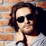 men long wavy hairstyle with sunglasses