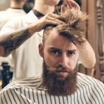 man getting haircut by hairdresser