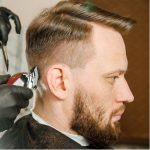 mens clipper taper cut side part hairstyle