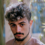 mens brown curly hair with white highlights