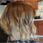 womens short blonde curled hairstyle bob cut