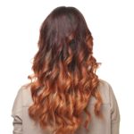 womens long copper color curl hairstyle