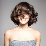 womens short brunette curly hairstyle